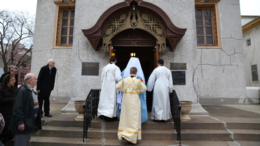 Orthodox bishop consecrated: Metropolitan Tikhon, in blue, enters Holy Trinity Orthodox Cathedral on Saturday before the consecration of Bishop Paul Gassios as new leader of Chicago and the Midwest. Abel Uribe/Chicago Tribune 
