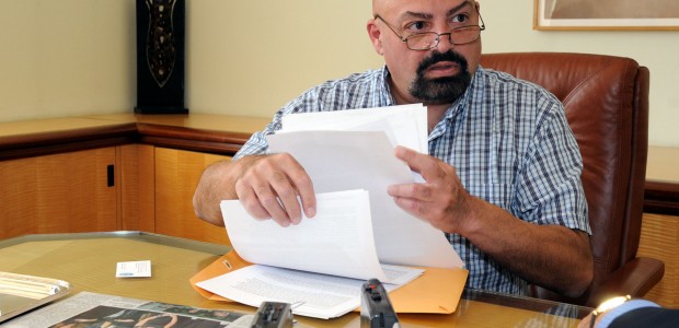 Alex Prodes, handling supporting documents, during the interview to TNH about his abuse.