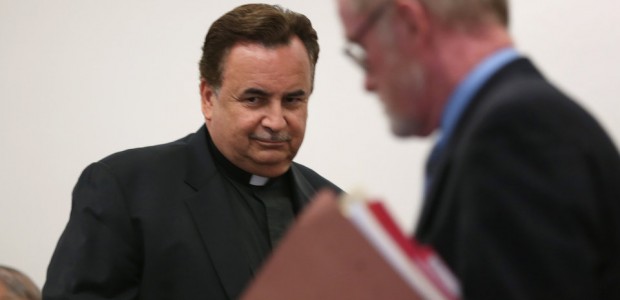 The Rev. James Dokos, left, and his attorney Patrick Knight appear in court in Milwaukee on July 18, 2014. (Abel Uribe / Chicago Tribune)