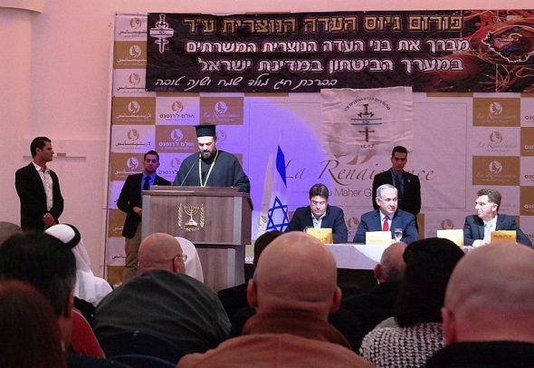Father Gabriel Naddaf addresses soldiers at an event of the Christian IDF Forum. (Wikimedia Commons/Maor X)