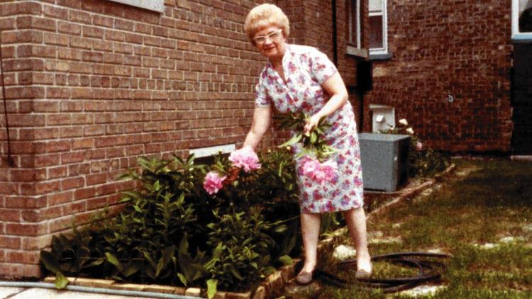 Nelly Bridgeman is seen picking flowers in 1982. The Rev. Nicholas Chervyatiuk is accused in civil court of improperly taking about $500,000 from the accounts of the 93-year-old parishioner Bridgeman, who has dementia. (Family photo)