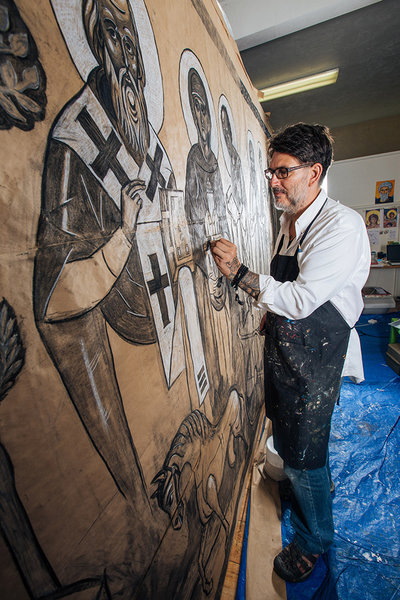 Using charcoal, artist Daniel Balter sketches saints in his studio at Whiteaker's St. John the Wonderworker Orthodox Church. Photo by Todd Cooper.