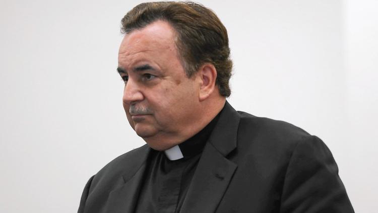 The Rev. James Dokos attends a court hearing in his criminal case July 18, 2014, in Milwaukee. (Abel Uribe, Chicago Tribune)