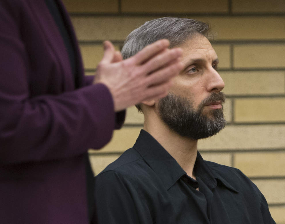 Eugene priest Daniel MacKay listens to his attorney, Terri Wood, before he was sentenced Thursday after a jury convicted him last week of paying for sex with an underage girln. (Andy Nelson/The Register-Guard)