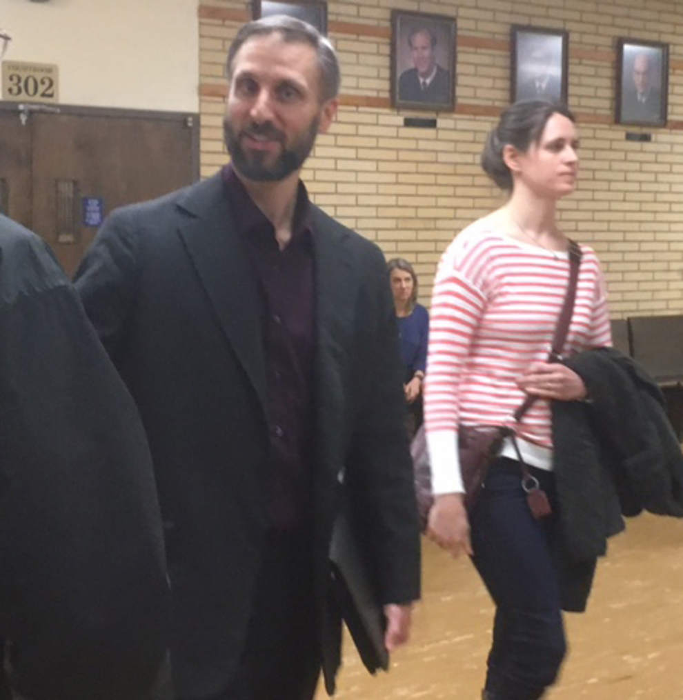 Daniel MacKay, 42, leaves court with his wife, Nancy. A jury on Thursday deliberated less than 90 minutes before finding the Eugene priest guilty of paying for sex with an underage prostitute. (Jack Moran/The Register-Guard)