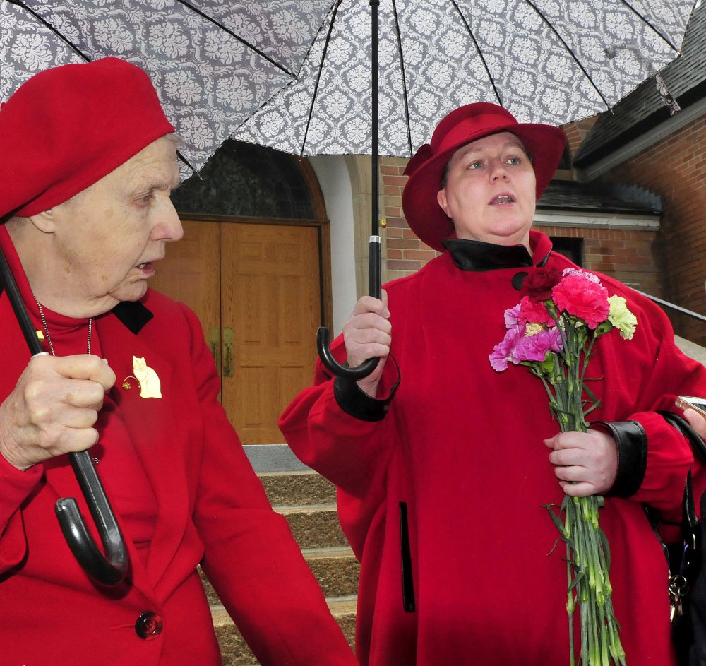 Margaret May Lambert, right, and her mother Mary Theresa Huebner, outside the St. Joseph Maronite Catholic Church Sunday in Waterville following a Mass, discuss the recent removal of Rev. Larry Jenson over allegations of sexual exploitation of a minor 15 years ago. Staff Photo by David Leaming