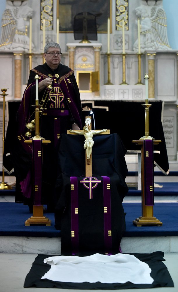 The Rev. Larry Jensen performs Good Friday rituals April 14 at St. Joseph's Maronite Church in Waterville. Staff file photo by Michael G. Seamans