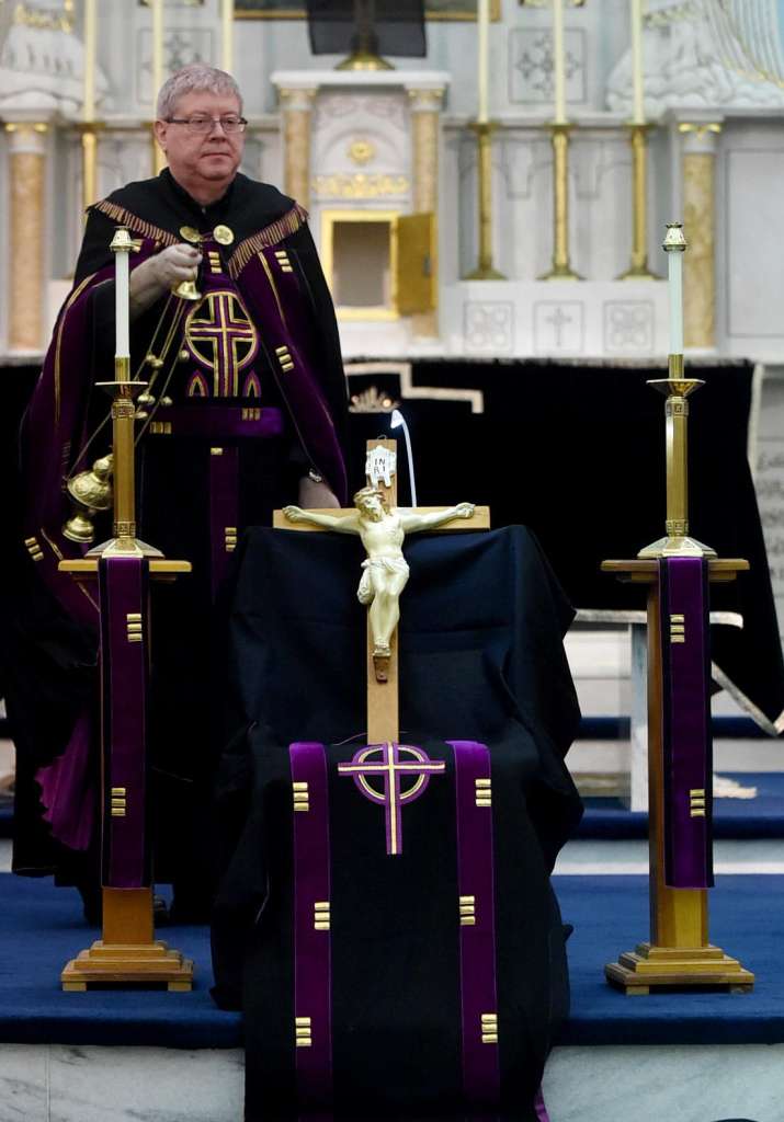 The Rev. Larry Jensen says Good Friday Mass on April 14, 2017 at St. Joseph's Maronite Church in Waterville, ME. Jensen has been removed from the church amid a