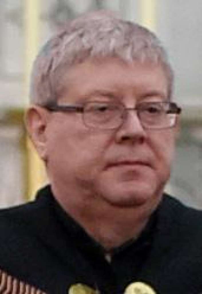 The Rev. Larry Jensen says Good Friday Mass on April 14, 2017 at St. Joseph's Maronite Church in Waterville, ME. Jensen has been removed from the church amid a