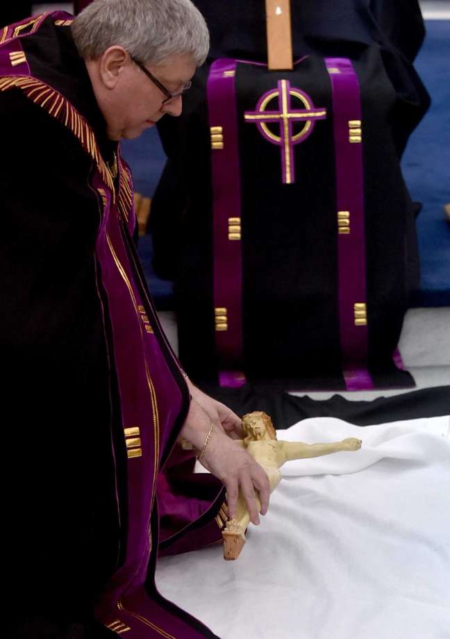 The Rev. Larry Jensen says Good Friday Mass on April 14, 2017 at St. Joseph's Maronite Church in Waterville, ME. Jensen has been removed from the church amid a