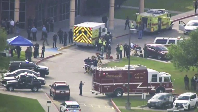 In this image taken from video emergency personnel and law enforcement officers respond to a high school near Houston after an active shooter was reported on campus, Friday, May 18, 2018, in Santa Fe, Texas. The Santa Fe school district issued an alert Friday morning saying Santa Fe High School has been placed on lockdown. (KTRK-TV ABC13 via AP)