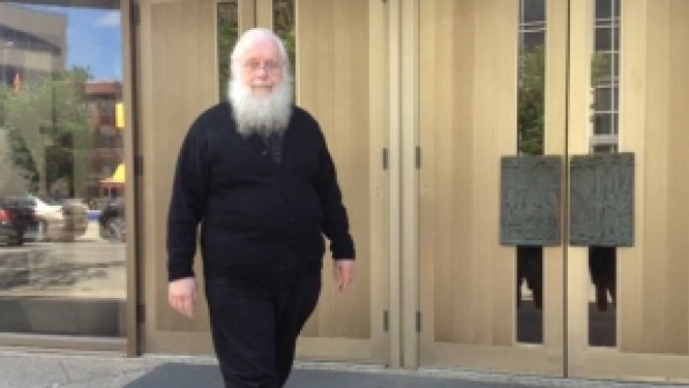 Seraphim Kenneth Storheim leaves the Winnipeg courthouse in June after his sentencing hearing. The former Orthodox priest convicted of sexually assaulting an altar boy will hear Thursday if he will be granted bail pending an appeal. (Nelly Gonzalez/CBC)