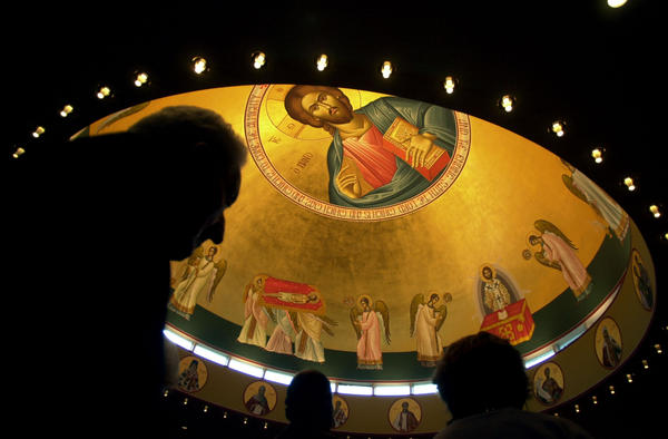 Parishioners of Saints Peter and Paul Greek Orthodox Church in Glenview on Wed. afternoon received the sacrament of Holy Unction under the newly painted dome. (HEATHER STONE )
