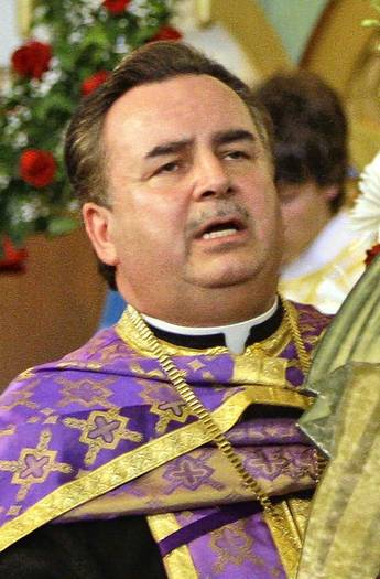 The Rev. James Dokos is accused of writing checks for tens of thousands of dollars to benefit himself, friends and family and to pay his personal credit card bills from the trust that he controlled, but that was set up primarily to benefit a Milwaukee church, according to a criminal complaint prepared by the Milwaukee County District Attorney's office. (Milwaukee Journal Sentinel / April 17, 2009)