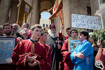 Priests and members of the Orthodox church gather on the steps of the former Georgian parliament in Tbilisi to stop a rally organized by LGBT activists. (Photo: Justyna Mielnikiewicz)