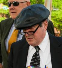 Michael Pasonick(wearing hat) leaves the federal courthouse in Wilke-Barre with his lawyer Joe Sklarosky Sr. after pleading guilty to a charge of bribing an area official.  Times Leader Photo: Don Carey 