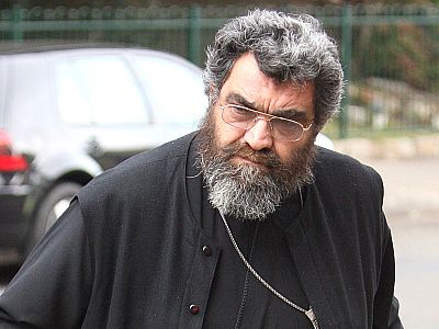 Father John Grillis is facing a charge of assault.