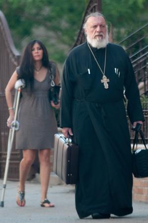 GREEK MUSE: Pastor George Passias leaves St. Spyridon Greek Orthodox in Washington Heights with his assistant and