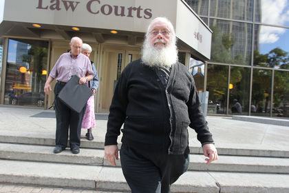 Archbishop Kenneth William (Seraphim) Storheim leaves the Law Courts Building after testifying in his own defence on Thursday. (KEVIN KING/WINNIPEG SUN)