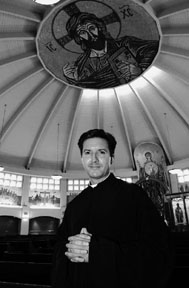 The Rev. Michael Pappas stands inside St. Basil Greek Orthodox Church on March Lane in Stockton in February 2002.  Pappas is resigning from the San Francisco parish he's led for the past three years.  (Record file)