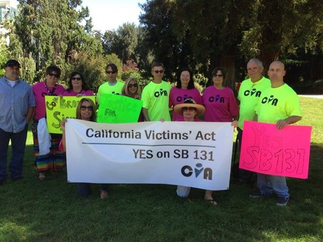 Rally in Support of SB 131 at the California State Capitol on September 20, 2013. Melanie Jula Sakoda of Pokrov.org is kneeling on right holding up the banner.