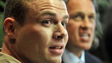 Staff photo by Michael Spooneybarger: Reservist Jasen Bruce, left, and his defense attorney Jeff Brown speak to the media at his office in St. Petersburg.