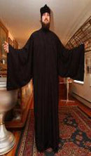 Father Panteleimon models a Bishop Nikolai Collection Riassa, an outer cassock, at the Russian Orthodox Museum in Anchorage. The bishop designed a clothing line for monks after seeing some clergy wearing shabbily made garments. (Erik Hill / ADN)