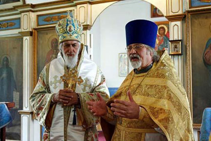 The Rev. Michael Spainhoward of St. Nicholas Russian Orthodox Church, right, speaks on June 24, 2007, as Bishop Nikolai Soraich listens at the conclusion of services. Bishop Nikolai has been ordered to take a leave of absence. Brian Wallace/Juneau Empire