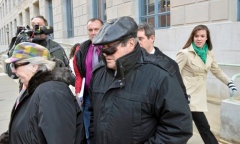 Jason Farmer / Times-Shamrock Michael Pasonick, right, leaves the William J. Nealon Federal Building and U.S. Courthouse in Scranton on March 9, 2012, after he was sentenced to one year in prison for bribing an unidentified school board member.