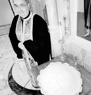 PHOTO COURTESY OF THE DALLAS MORNING NEWS Rev. Nick Katinas stands next the koliva which he had just prepared at Holy Trinity Greek Orthodox Church in Dallas, Texas in the March 22, 1998 photo. Father Katinas has been accused sexual misconduct with minors, and was suspended from the priesthood last summer, just a few days after he retired.