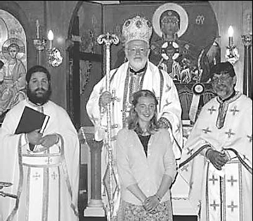 Priest-monk Alexios Marakis (left) seen at a church in New England.