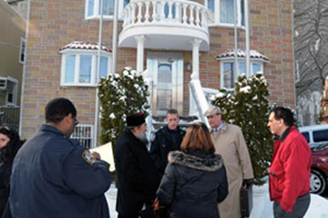 Bishop Vikentios of Apameia and his attorney George Razis make a statement to the police outside of the offices of the St. Irene Chrysovalantou Monastery in Astoria. Costas Bej/TNH