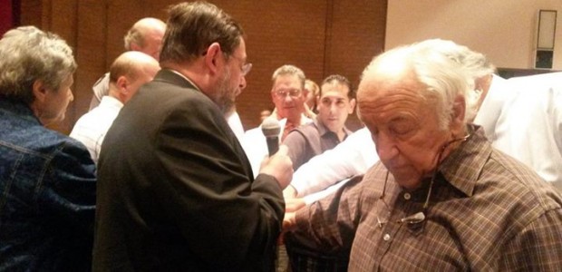 Rev. Luke Uhl recites the oath of office to the first parish council of the new “Mission” parish.