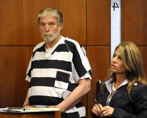 Accused child molester Robert Ruark appears with his attorney during his arraignment Monday. Ruark was arrested Thursday night in connection with what is expected to be more than 30 counts of child molestation. (Rick Roach/RRoach@TheReporter.com)