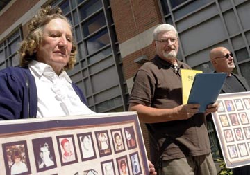 From left, Ruth Moore, David O'Regan, and Skip Shea of the Survivors Network of Those Abused by Priests gather as Mr. O'Regan reads a statement in front of Worcester Trial Court today. (T&G Staff/RICK CINCLAIR)