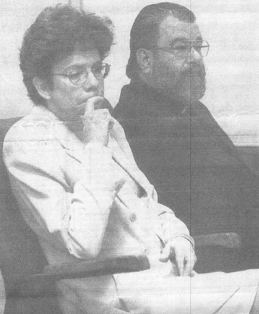 The Rev. Emmanuel Koveos, suspended pastor of Dormition Church in Burlington, listens with lawyer Karen Shingler to opening statements Tuesday in his trial at Vermont District Court. Koveos is charged with fondling a preteen girl on church property. 